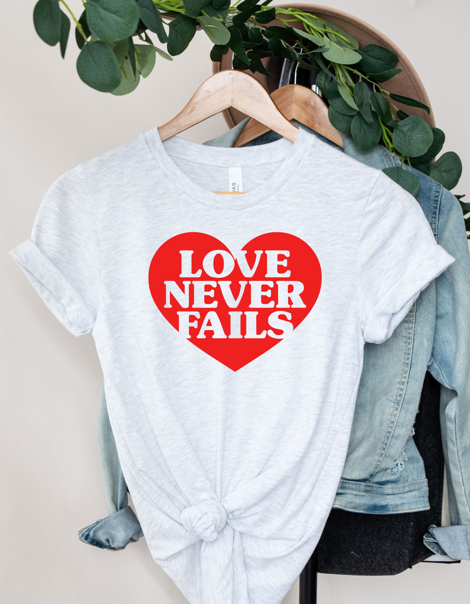 Love Never Fails Women Short Sleeve Graphic Tee